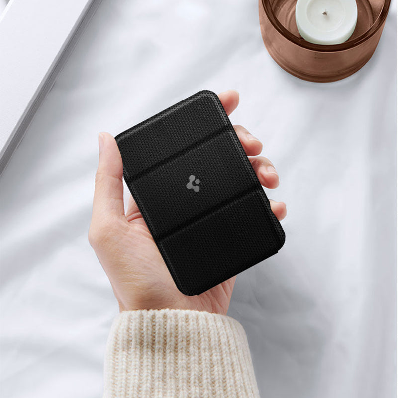 Magnetic Card Holder Mobile Phone Holder Card Holder Accessories in hand, featuring a simple design in classic black.